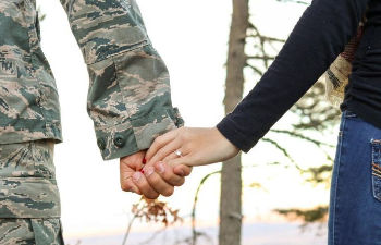 an office desk with a computer keyboard and stationeries