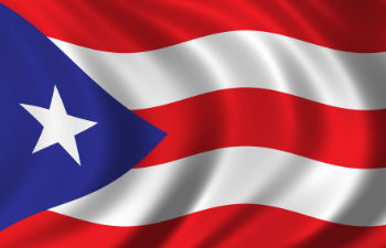 an office desk with a computer keyboard and stationeries